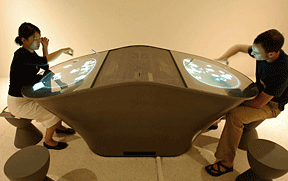 Figure 8: Visitors interacting with the off–gallery "Dialog Table."